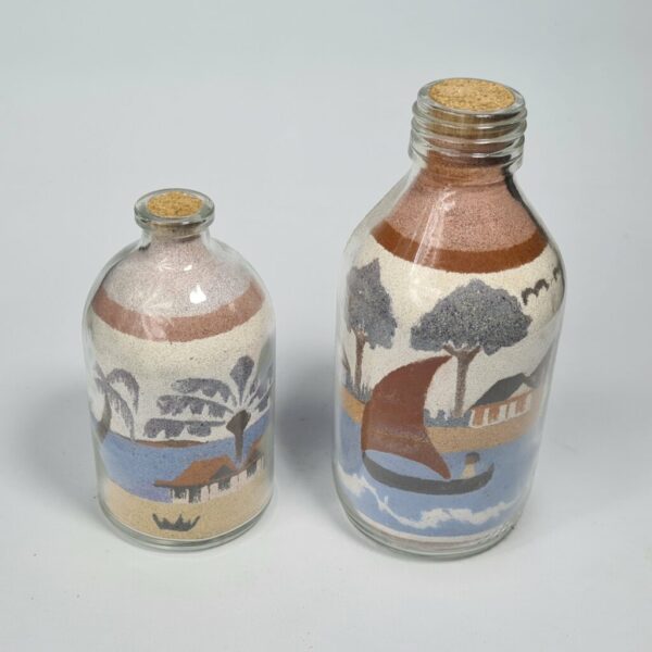 Dessin sur sable fin en bouteille